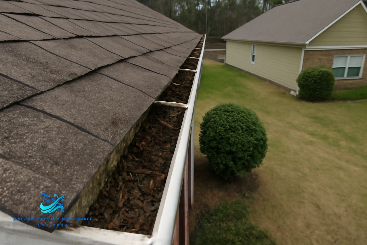 Clean gutters and soft-washed roofline on a two-story home in Lawrenceville Georgia