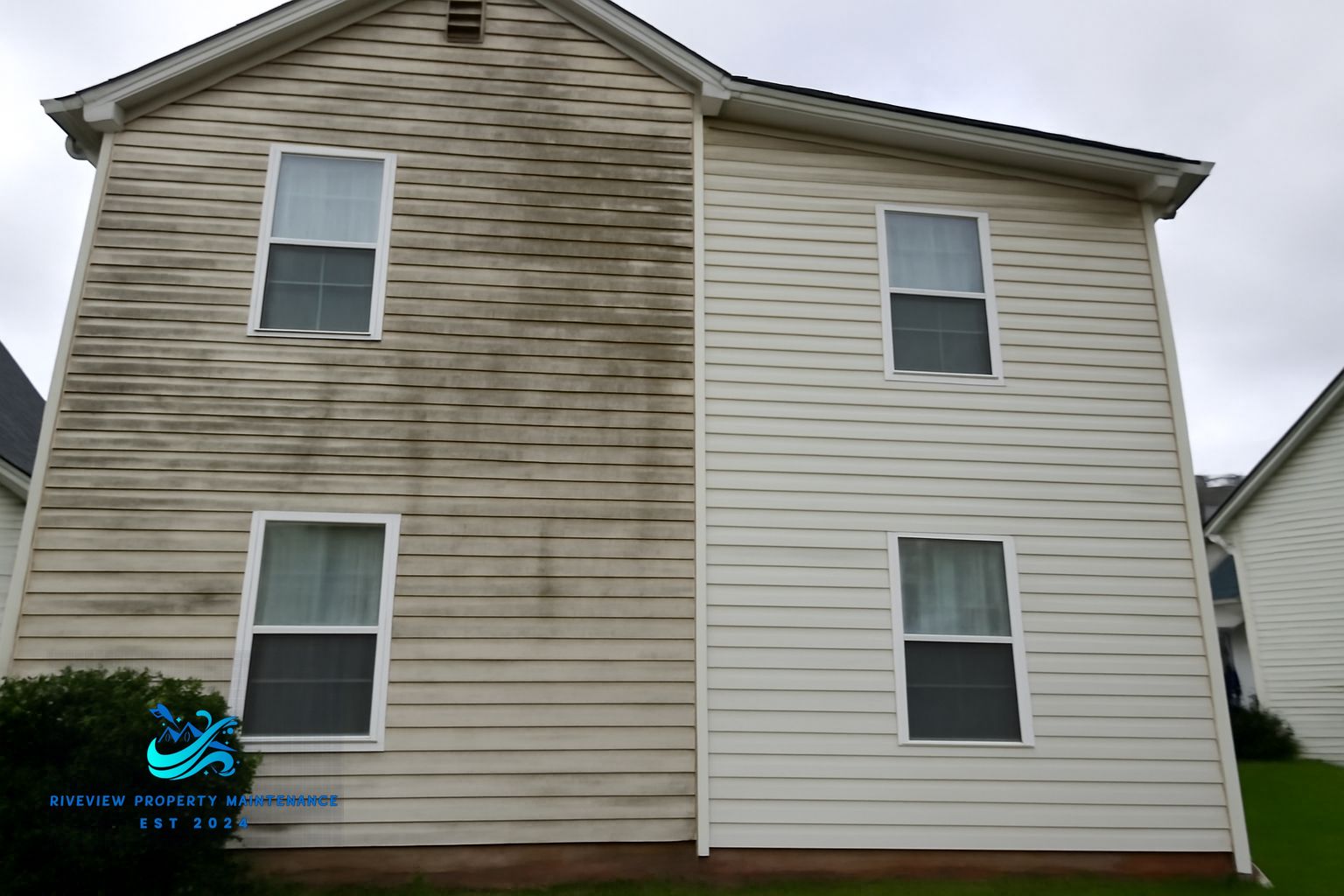 Soft washing a vinyl-sided home in Buford, GA to remove mildew and pollen buildup