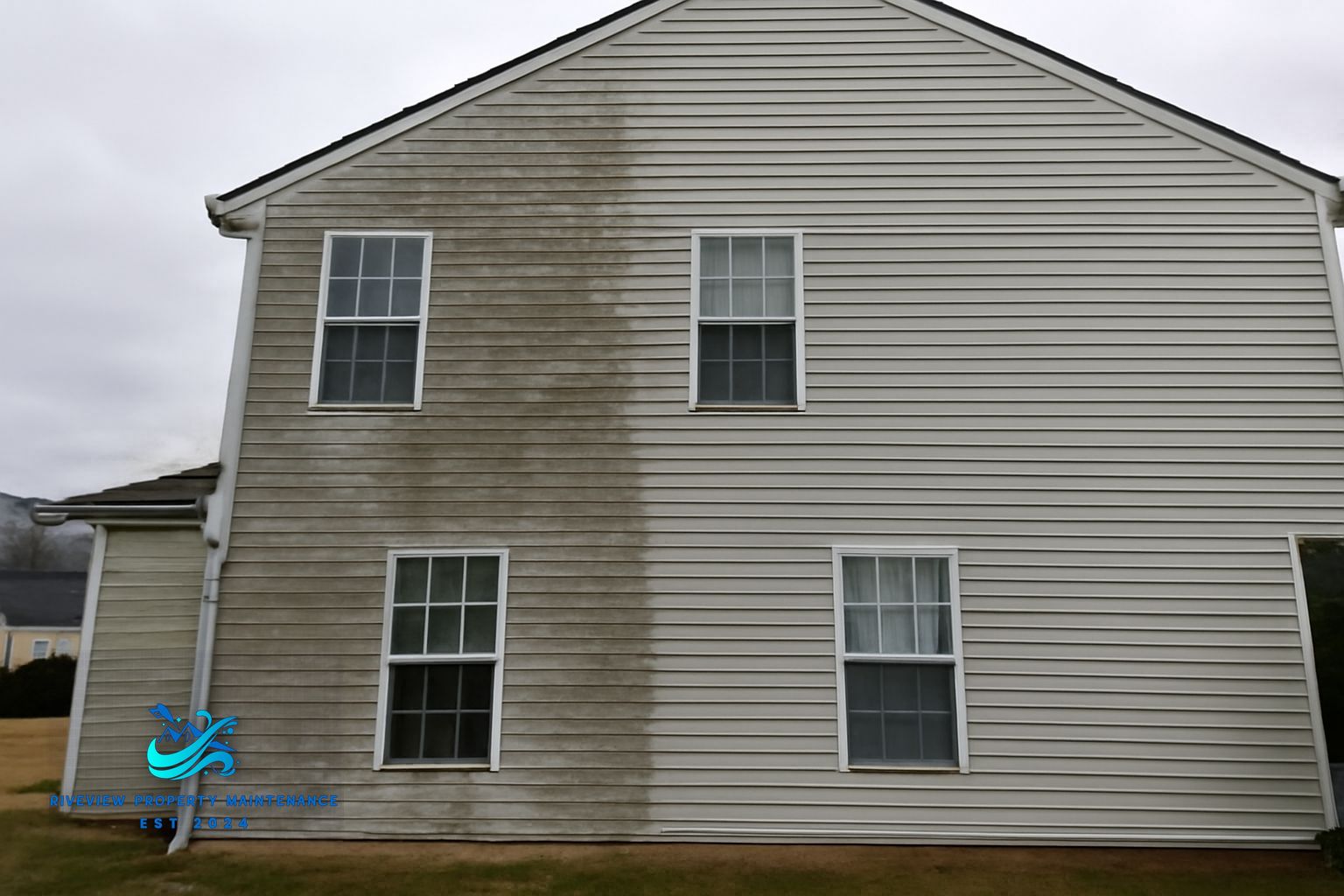 Soft washing removes black mildew streaks from vinyl siding on a Lawrenceville GA home