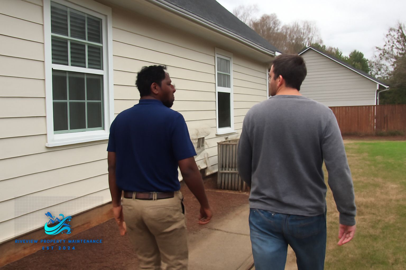 Riverview technician soft washing brick exterior on a Gwinnett County home