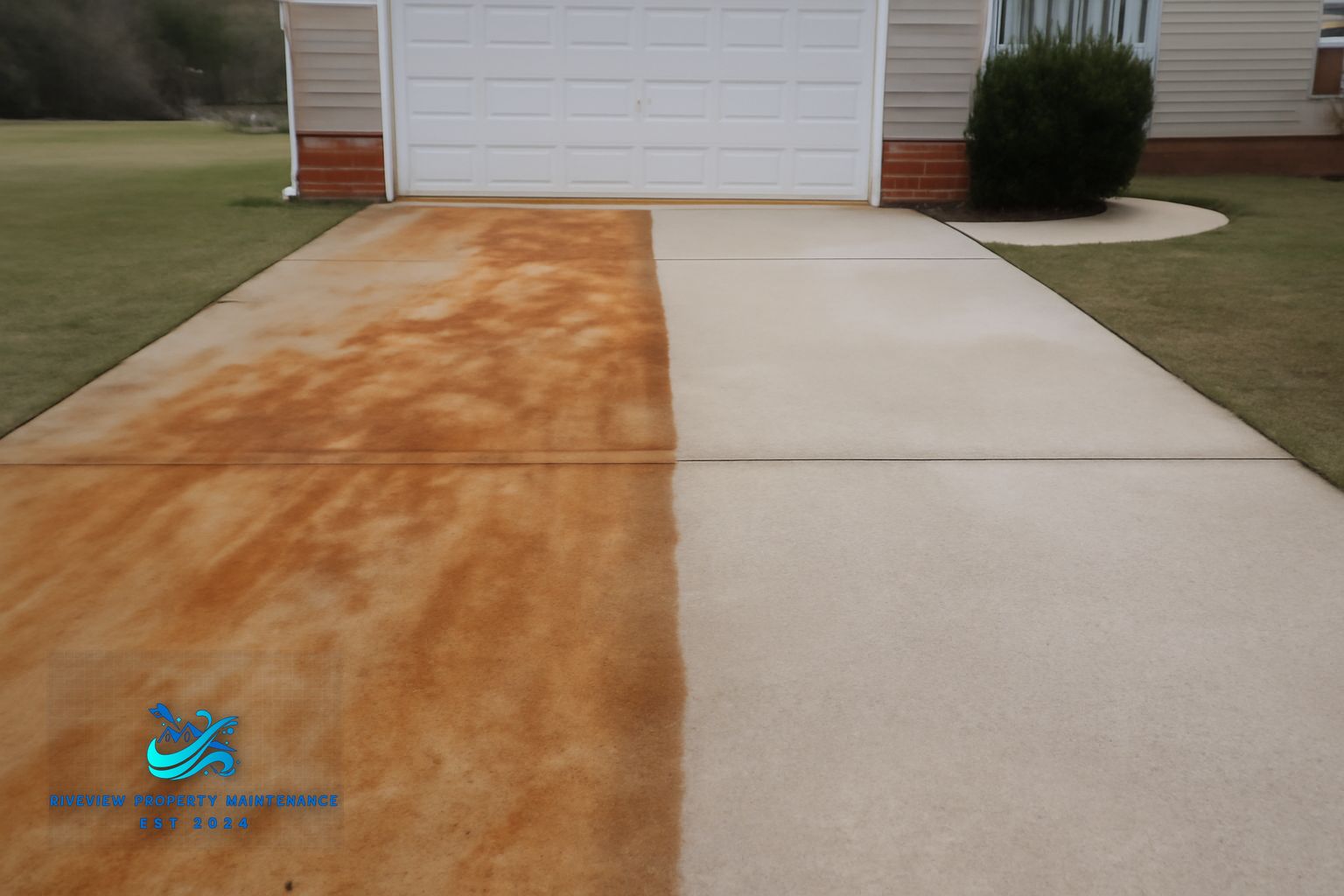 Riverview Property Maintenance pressure washing a patio in Winder GA using commercial hot-water equipment