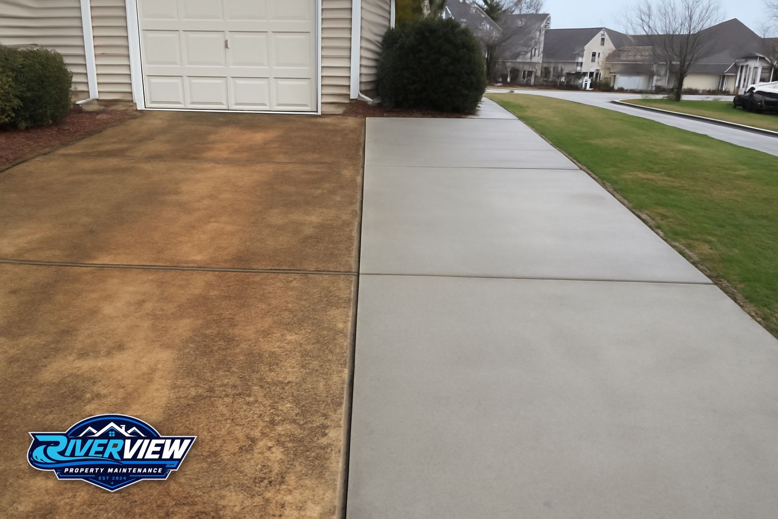 Concrete driveway in Winder GA with red clay staining before pressure washing