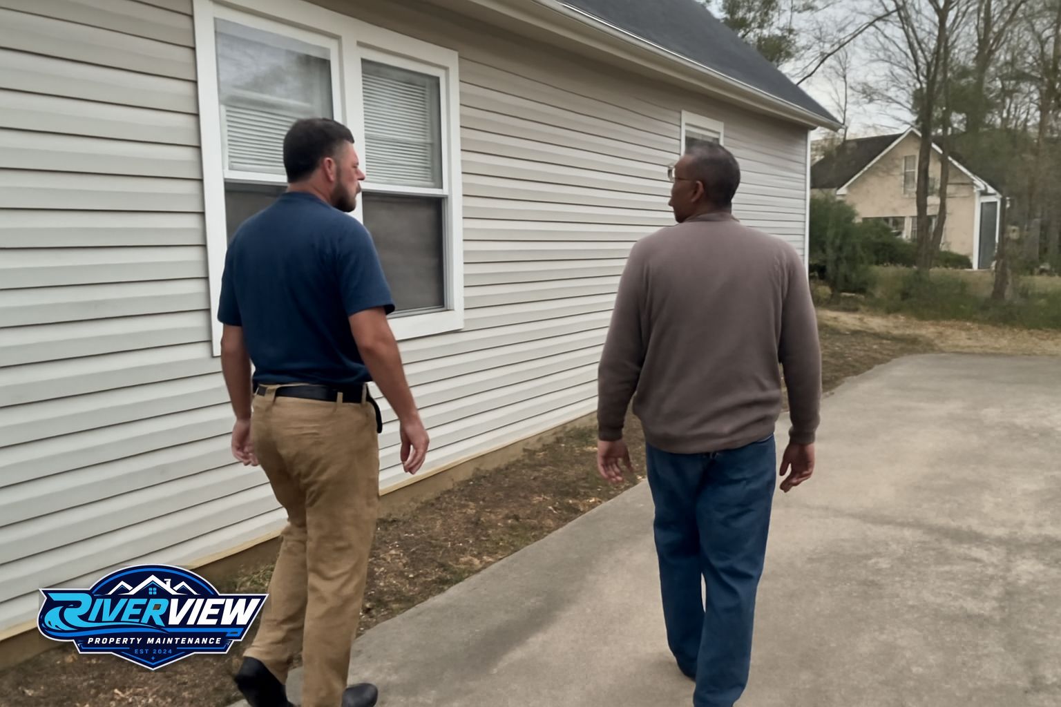 Riverview technician applying soft wash solution to a shingle roof in Barrow County