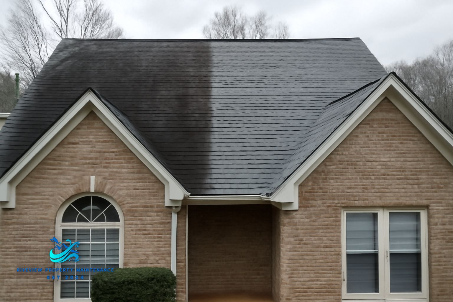 Black algae streaks on asphalt shingle roof in Grayson GA before soft washing