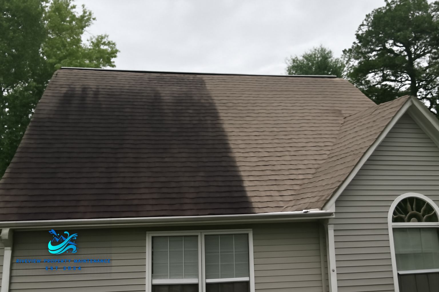 Clean shingle roof and soft-washed siding on a Lawrenceville, GA home after Riverview treatment