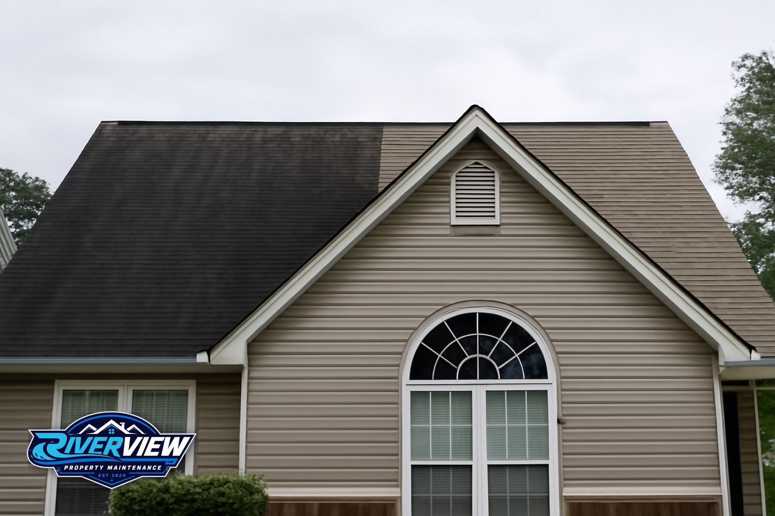Black algae streaks on asphalt shingles on a Lawrenceville, GA home before soft washing
