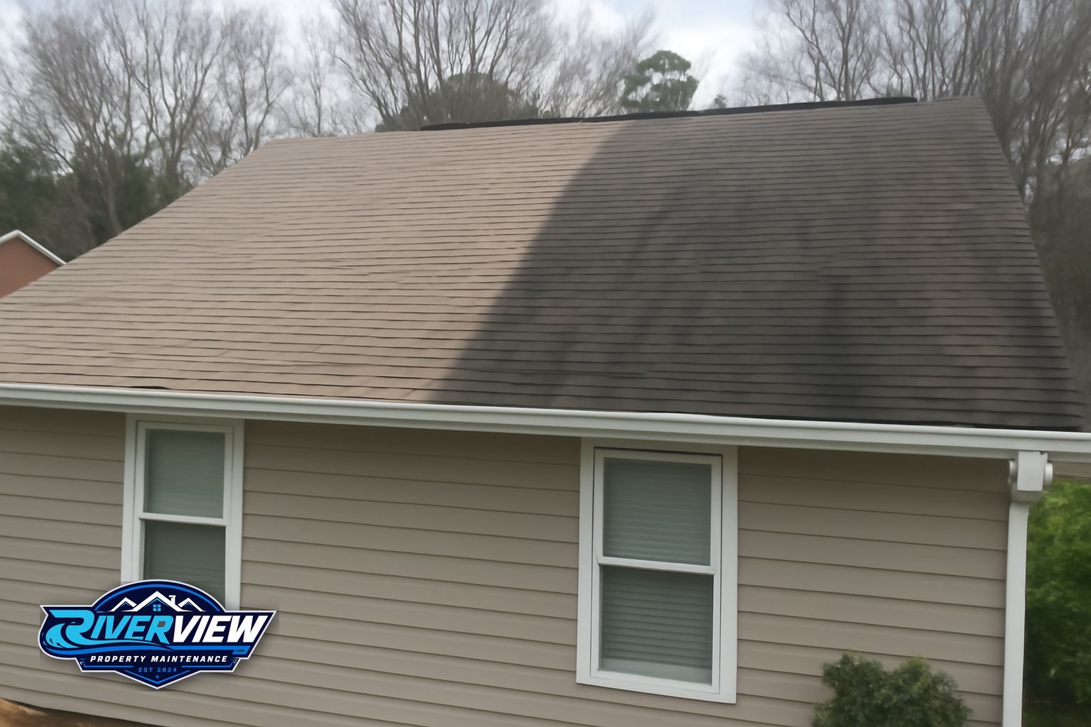 Clean asphalt shingle roof on a Gwinnett County home after soft washing by Riverview Property Maintenance