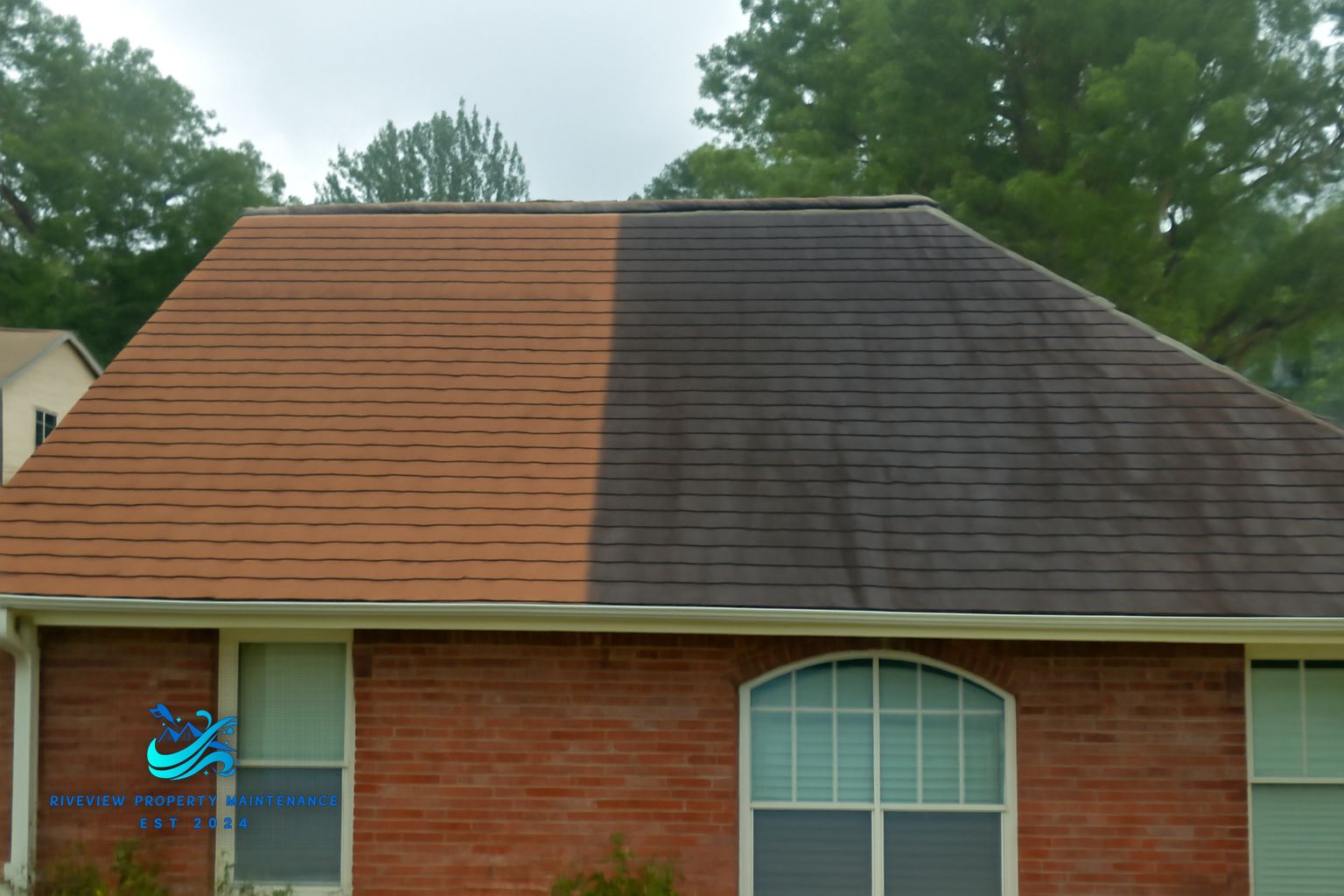 Riverview Property Maintenance technician soft washing a residential roof in Lawrenceville Georgia with low-pressure equipment