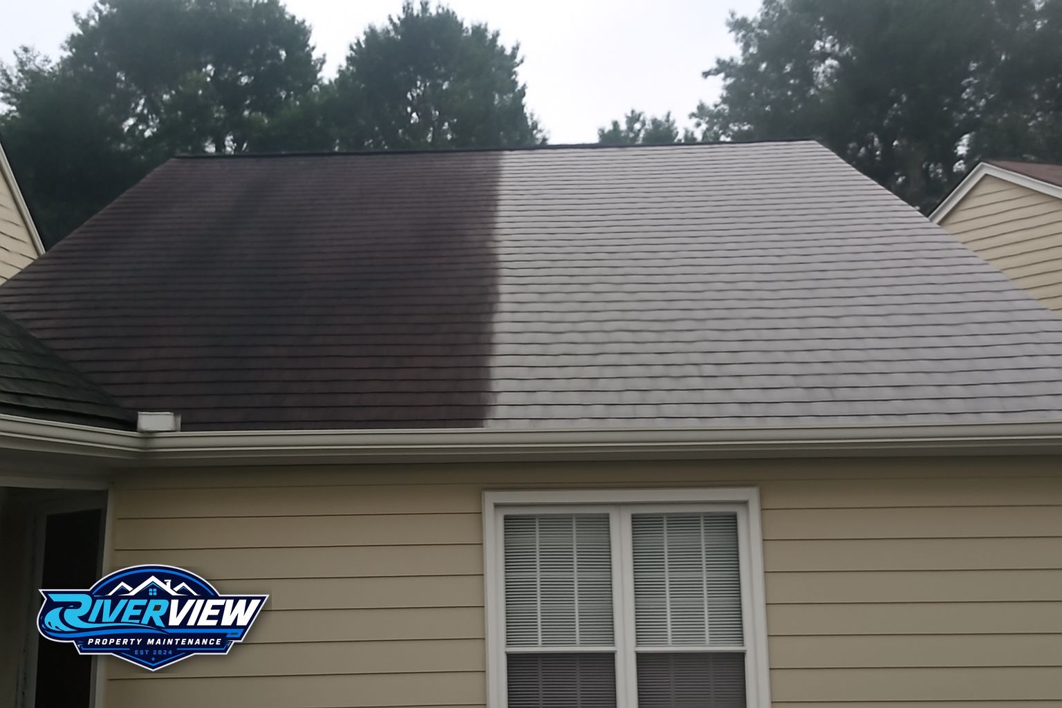 Riverview Property Maintenance technician applying soft wash solution to roof in Lawrenceville GA
