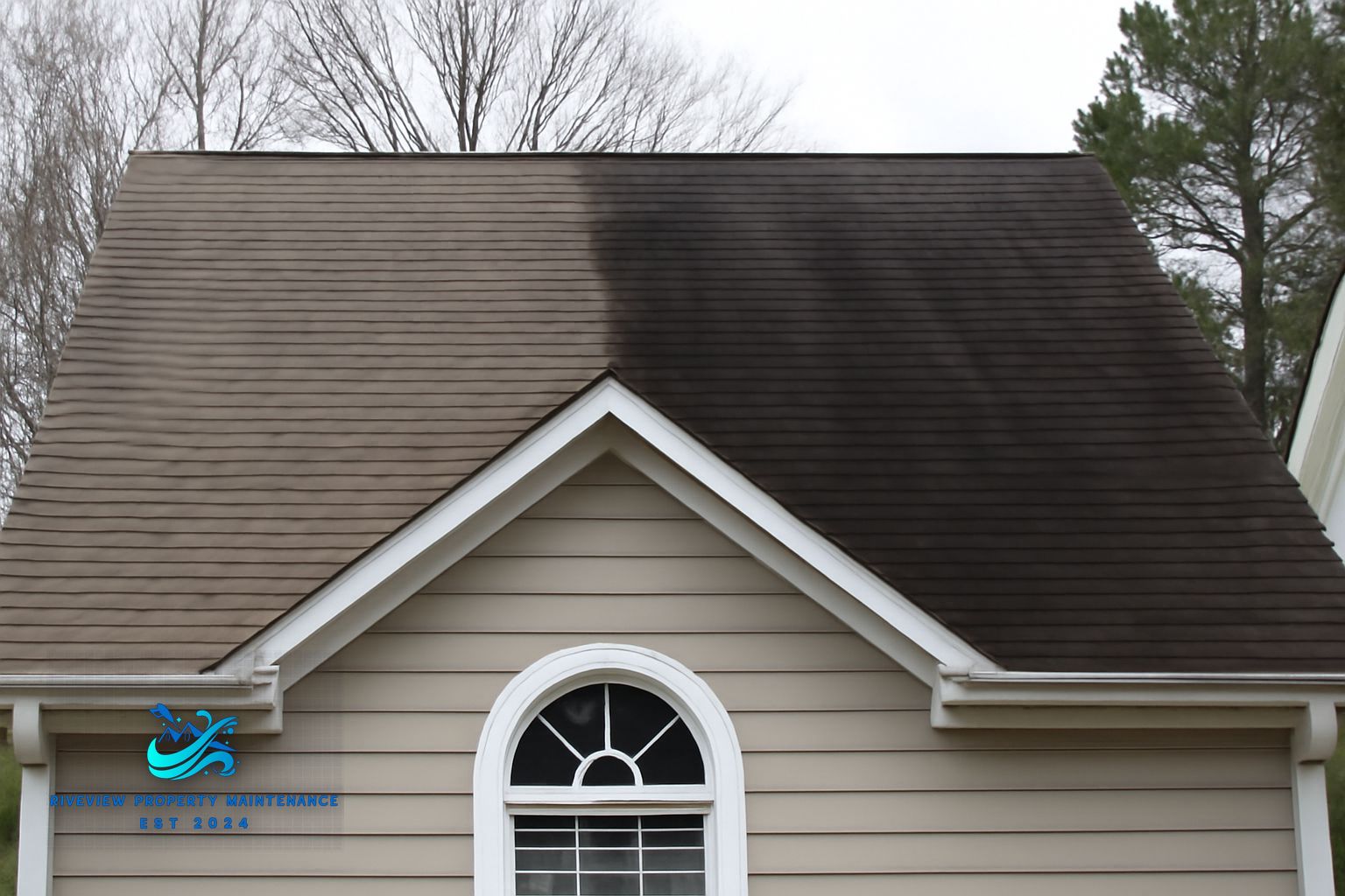 Riverview Property Maintenance technician applying soft wash solution to a shingle roof in Lawrenceville Georgia
