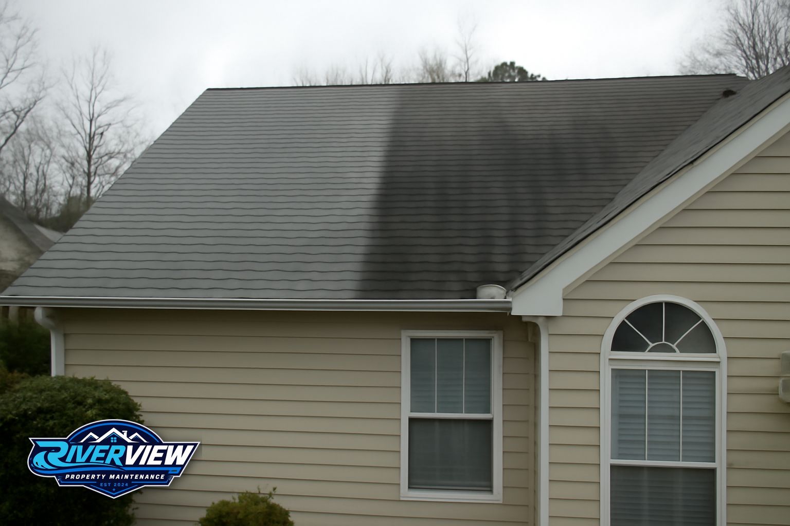 Riverview Property Maintenance technician preparing equipment for roof soft washing in Lawrenceville GA
