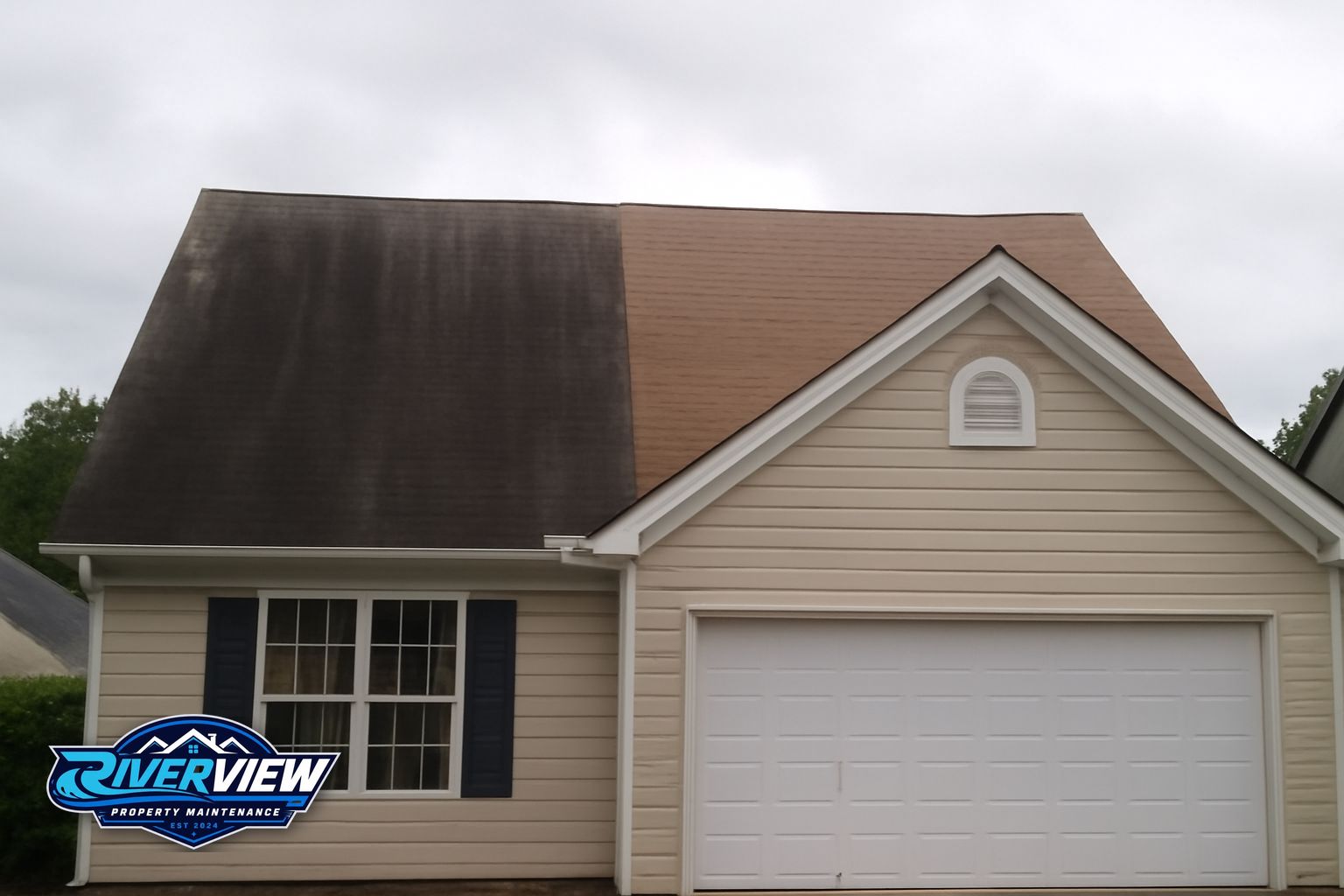 Roof soft washing removing black algae streaks from asphalt shingles on a Loganville Georgia home