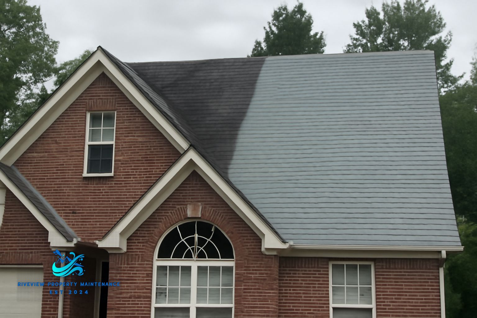 Black algae streaks running down asphalt shingles on a Gwinnett County home roof