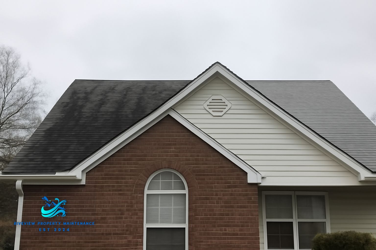 Dark algae streaks on an asphalt shingle roof in Mulberry, GA before soft washing