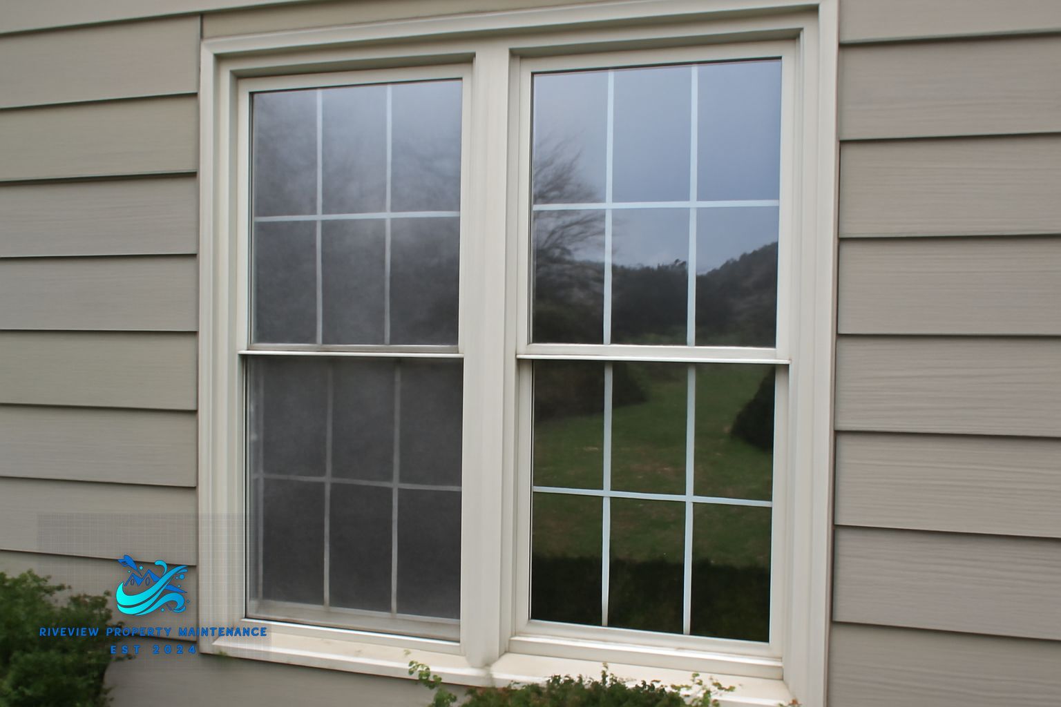 Buford home with clean windows, freshly washed siding, and a clean concrete driveway