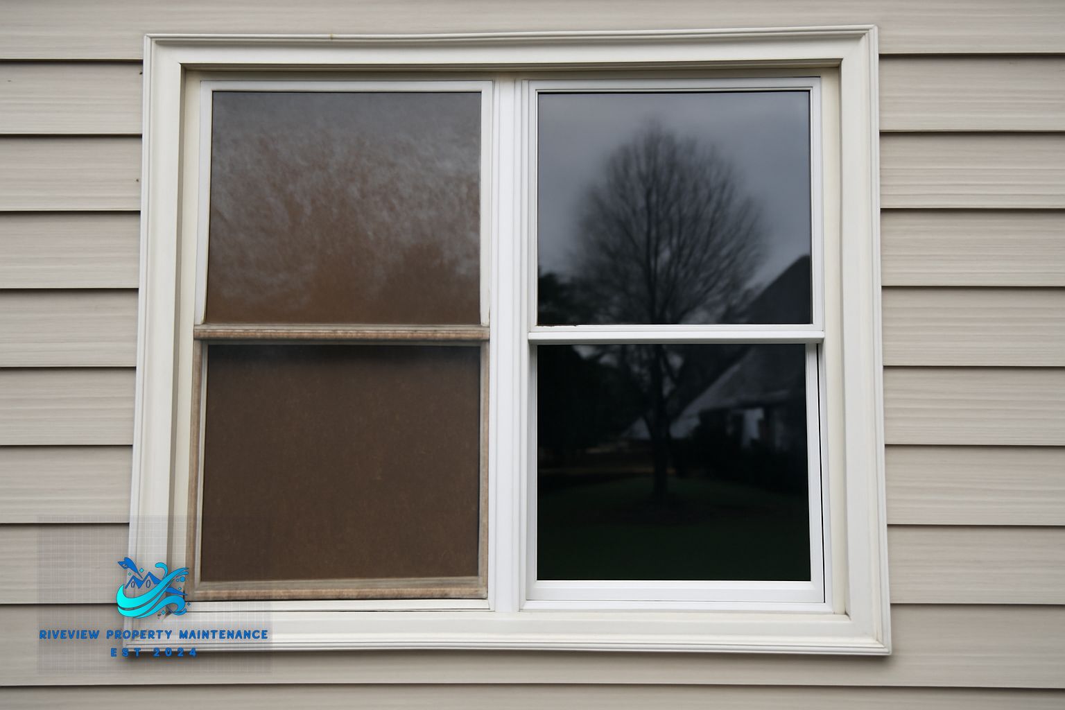Technician cleaning exterior windows on a two-story home in Dacula Georgia