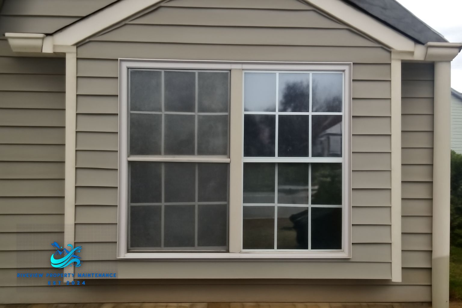 Riverview Property Maintenance technician cleaning windows on a Winder GA home