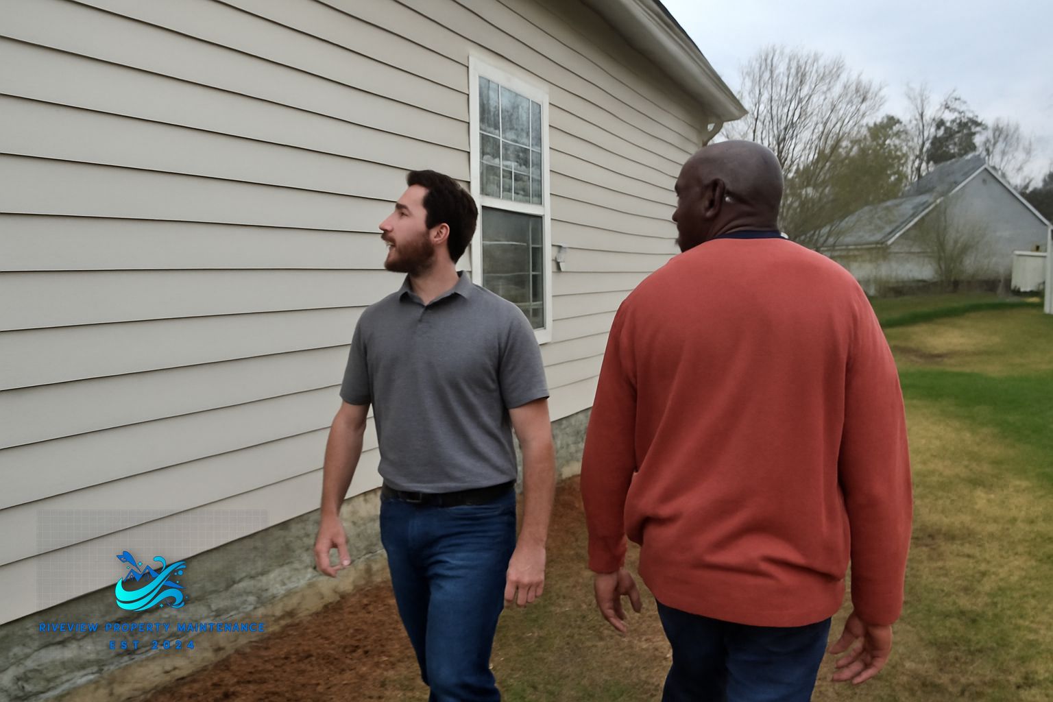 Technician cleaning exterior windows and gutters on a Barrow County home